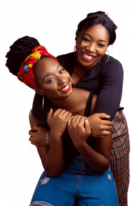 two black girls hugging and smiling